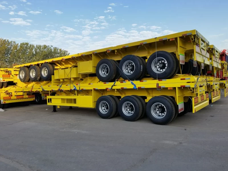 ⁦Best selling factory direct sale 3/4 axles heavy duty flatbed Semi Trailer 20FT 40FT Flat Bed Container truck trailers⁩ - الصورة ⁦5⁩