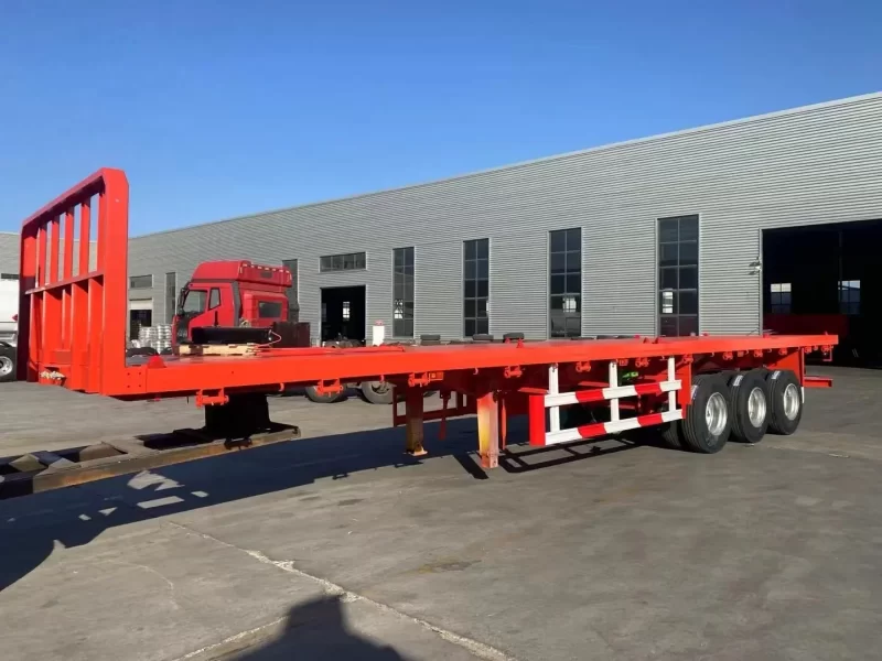 ⁦Best selling factory direct sale 3/4 axles heavy duty flatbed Semi Trailer 20FT 40FT Flat Bed Container truck trailers⁩ - الصورة ⁦3⁩